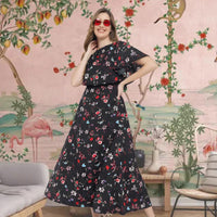 Front view of black floral full-length gown in palace interior