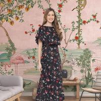 Side profile of floral gown in black in palace setting