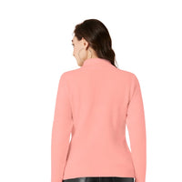 Back studio pose of women's peach high-neck top