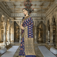 Navy Banarasi against crashing waves, gold borders mimicking lightning on water