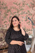 Front view: Black kurti against a soft golden-hour skyline