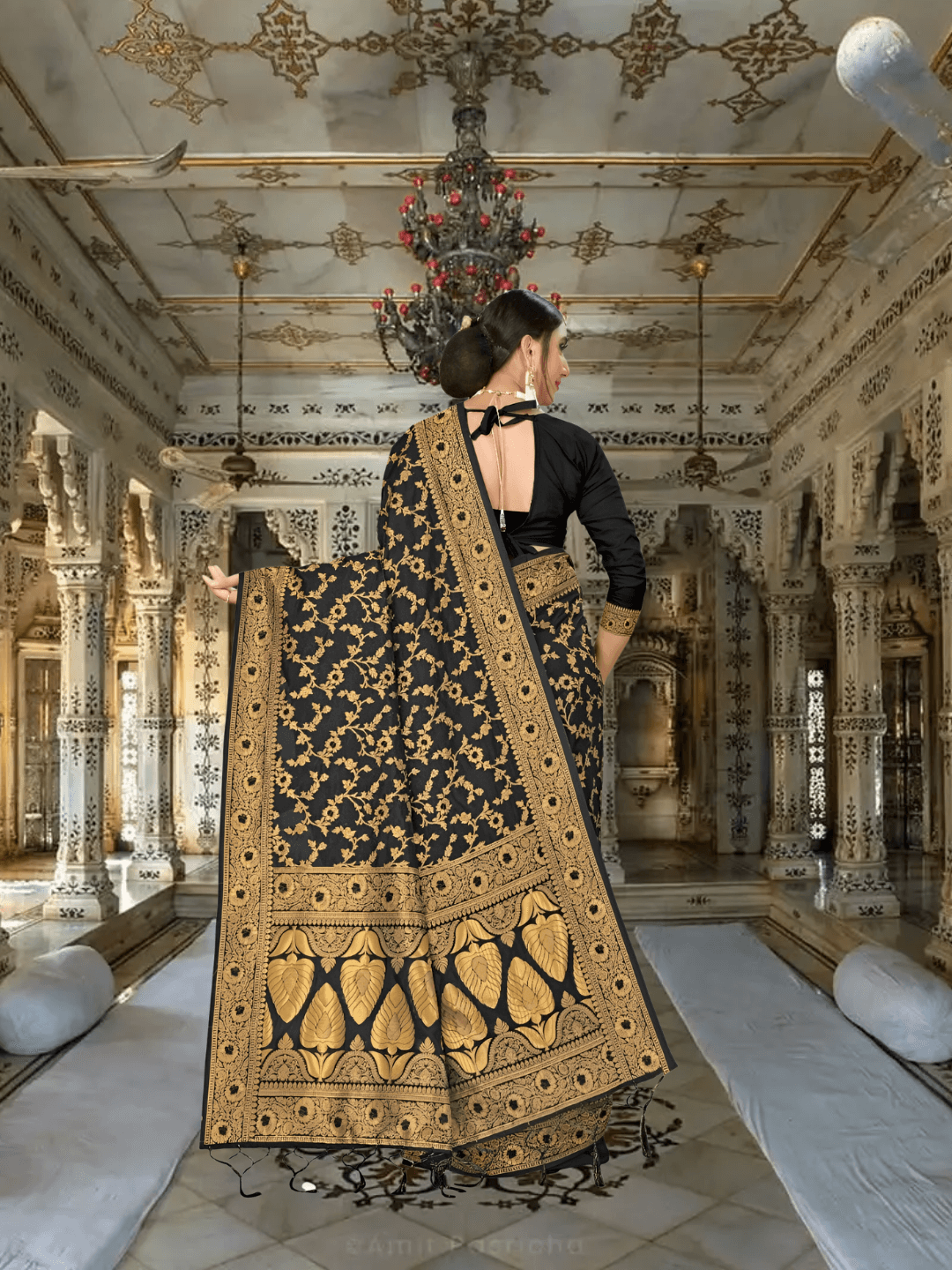 Close-up of intricate gold-yellow floral embroidery on black silk