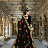 Model mid-step, saree flowing like spilled ink, silver stitches catching candlelight