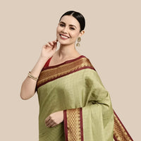 Studio front shot of olive checkered saree with blouse