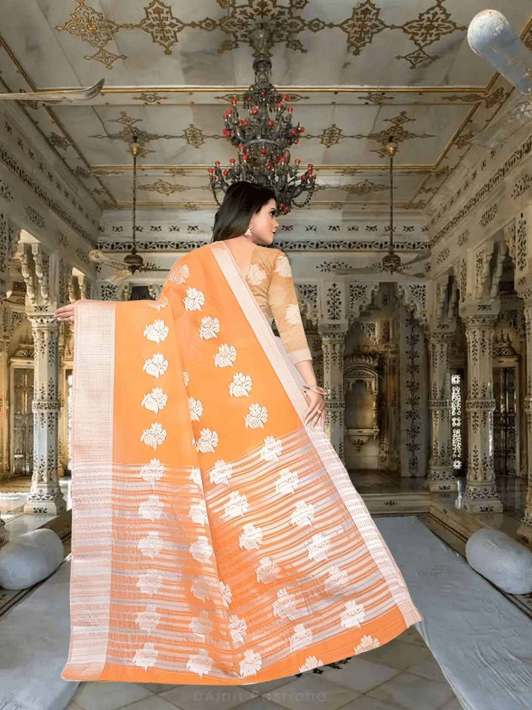 Traditional drape style for orange cotton silk saree with pleated pallu