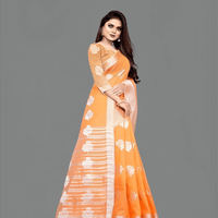 Woman wearing orange cotton silk saree in sunlight - perfect for outdoor weddings