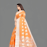 Close-up of intricate gold zari embroidery on orange cotton silk saree border