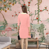 Back view showing sleek peach silhouette and white collar detail