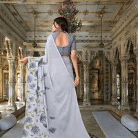 Model twirling to show floral pallu movement