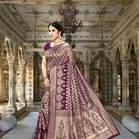 Model wearing jamun purple silk saree entering a palace-style hallway with glowing gold borders