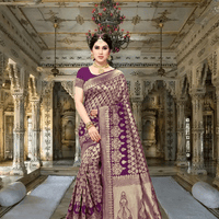 Model wearing jamun purple silk saree entering a palace-style hallway with glowing gold borders