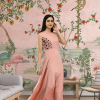 Left side view of sleeveless peach crepe gown for women