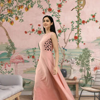 Right profile of soft peach gown with full-length silhouette