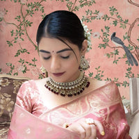 Pallu close-up in palace room glowing with embellishment