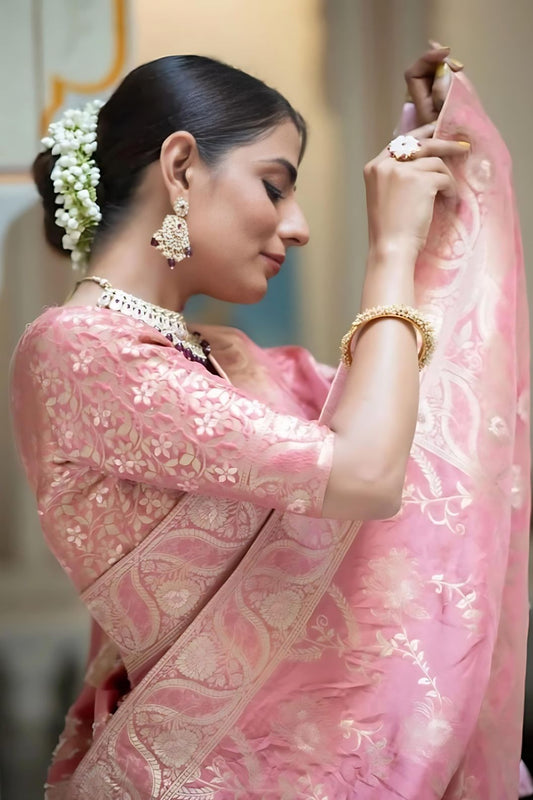 Studio close-up of peach embellished pallu in focus