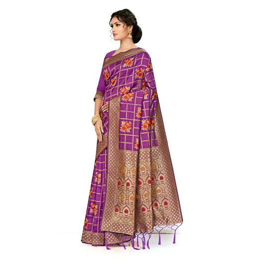 Pleats showing aligned floral and gold patterns on purple silk in studio lighting