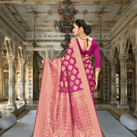 Close-up of golden zari pallu on wine Banarasi silk saree in royal backdrop