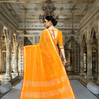 Back pose, fabric cascading like a vintage scroll of notes and patterns