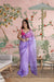  Front view of CELESTINA purple organza saree in royal palace setting