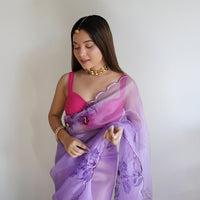 Front view of CELESTINA purple organza saree in royal palace setting