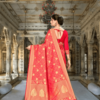 Golden pallu drape of Banarasi saree flowing in regal setting