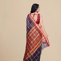 Studio back angle showing unstitched blouse combo and pallu trail