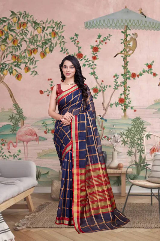Front view of navy blue checkered saree radiating elegance in palace lighting