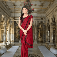 Elegant back drape of red saree with pleated pallu