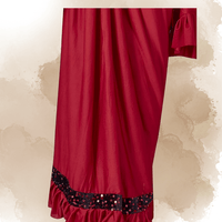 Close-up of stretchable red Lycra fabric showing wrinkle-resistant weave