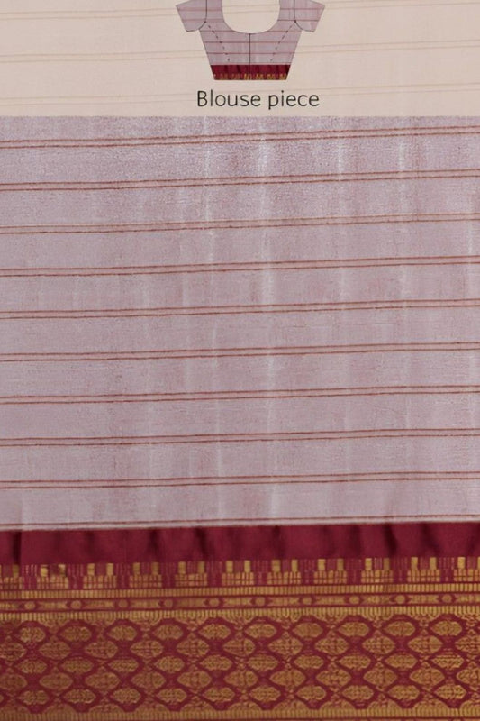 Close-up of pallu showing maroon threadwork and silk blend