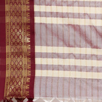 Close-up of pallu showing maroon threadwork and silk blend