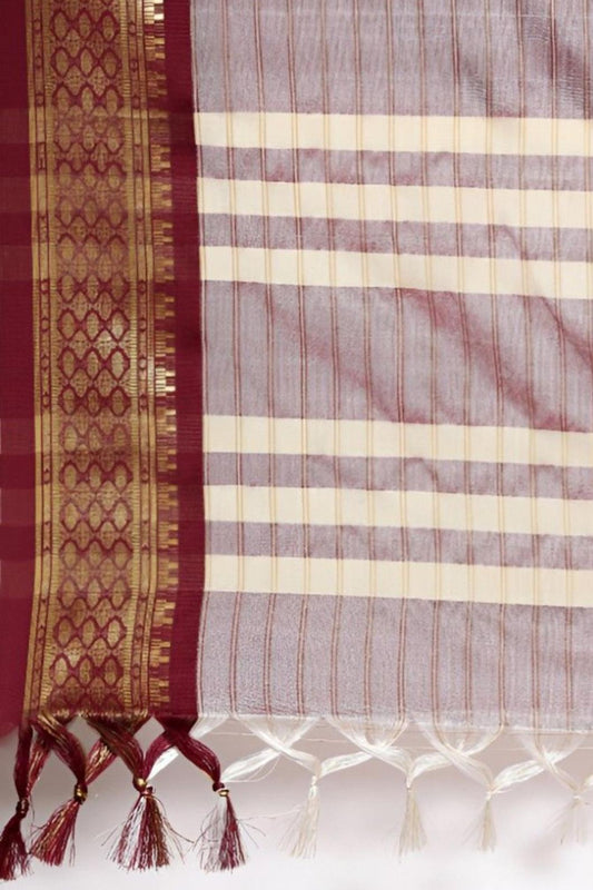 Close-up of pallu showing maroon threadwork and silk blend