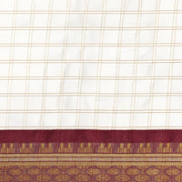 Close-up of pallu showing maroon threadwork and silk blend