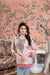 Front view of pink kurti bathed in morning light