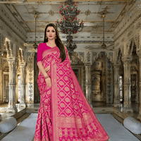 Pink Kanjivaram silk saree glowing in regal ambience, gold threads sparkling in archway light