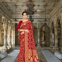 Vibrant maroon saree in sunlight, gold florals reflecting like scattered coins
