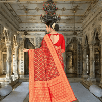 Golden pallu of red silk saree flowing in royal palace backdrop
