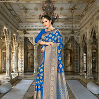 Close-up of golden border on rich blue Banarasi silk saree in heritage setting