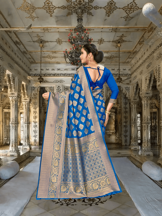 Pallu of wine-blue Banarasi silk saree with gold zari details flowing elegantly