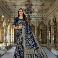 Navy blue silk saree cascading like velvet in a palace corridor, gold thread glowing softly.