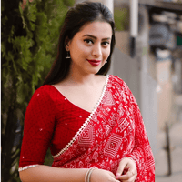 Red abstract georgette saree against modern art backdrop