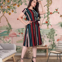 Celestina "Scarlet Horizon" Women's Red and Blue Crep Short Sleeve Dress worn by a model, radiating confidence and style.