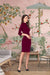 Side angle showing the flow and texture of the Scarlet Verse maroon knit dress
