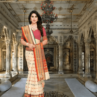 Model draped in cream Kota Doria saree standing gracefully in palace room setting