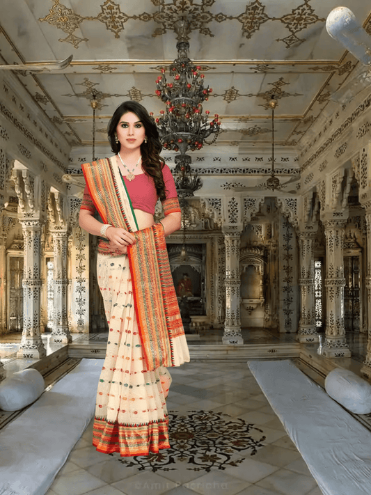 Model draped in cream Kota Doria saree standing gracefully in palace room setting