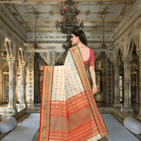 Cream saree pallu gently flowing with soft lighting in palace-inspired backdrop