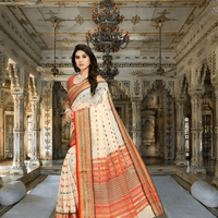 Front-facing pose of cream saree showcasing subtle elegance and border design