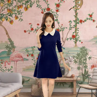Model in navy dress with white collar in Japanese-inspired set
