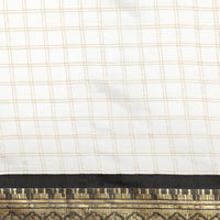 Close-up of the woven fabric with a checkered pattern and a decorative border.