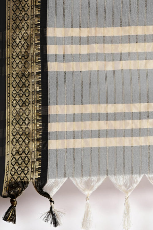 Close-up of the woven fabric with a checkered pattern and a decorative border.